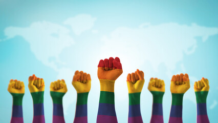 LGBT pride month with rainbow flag pattern on LGBTQ+, LGBTQIA, gay, lesbian people hands isolated on world blue sky background for International day against homophobia and transphobia