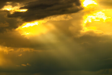 sun rays and clouds with sunset colors
