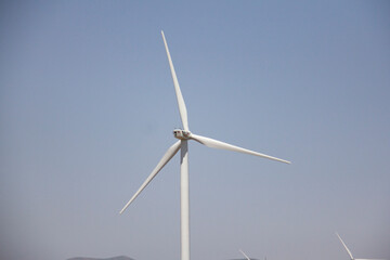 Fototapeta premium A wind farm in Qazvin province in Iran, which includes tall columns and generators that generate electricity with the wind (kahak windfarm)