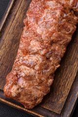 Raw pork ribs marinated with salt, spices and herbs