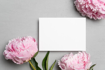 Invitation or greeting card mockup with peony flowers, blank card mock up with copy space