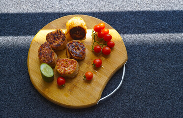 Roulette on the board with wheat and tomatoes