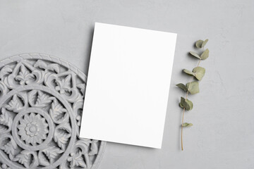 Blank invitation or greeting card mockup, white paper card with copy space, flat lay