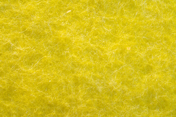 Macro image of the texture of yellow kitchen cloth