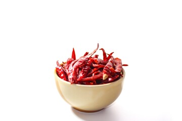 Put the chilies in the bowl and put on white background with isolated concept.
