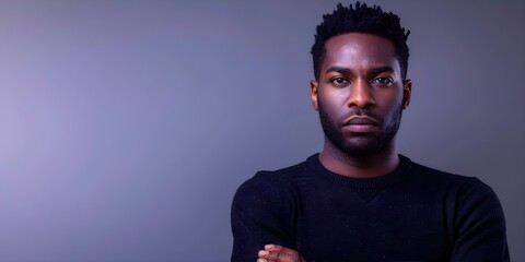 African man in black sweater on pastel background explores anger management. Concept Portrait Photography, Emotions, Anger Management, Pastel Background, African Man