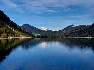 Early morning canoe trip on an alpine lake
