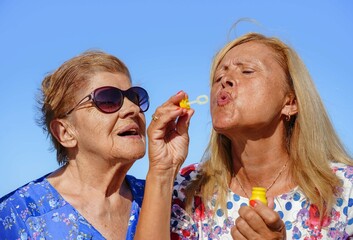 happy women family having fun outdoors in summertime. Active elderly. Mental health in adults