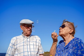 elderly couple having fun in summer holidays. Mental health in elderly