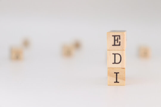 EDI acronym. Concept of Electronic data interchange written on wooden cubes isolated on white background.
