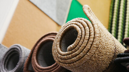 Close-up of beautiful rolled wool carpets on the market