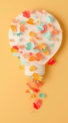 Vertical image of a light bulb with paper butterflies coming out of it.