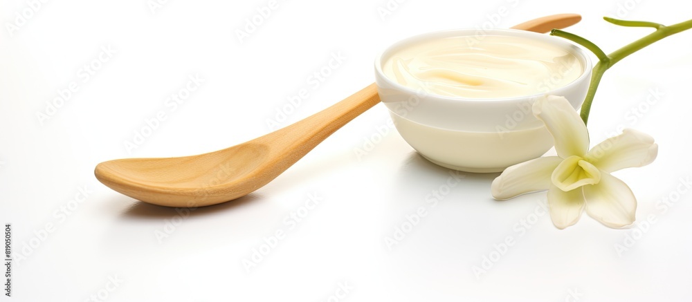 Poster copy space image of vanilla sticks and a spoon on a white background emitting a delightful aroma