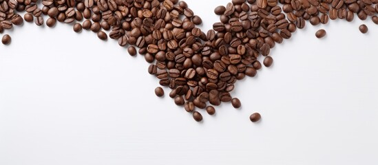 I love coffee concept top view of a cup of coffee with the roasted coffee beans aligned to heart shape on the white table. copy space available