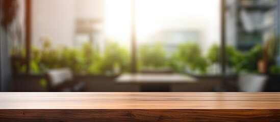 Perspective wood table counter in home office Empty wooden tabletop with blurred workplace background Mock up template for display or montage of your design Banner for advertise of product