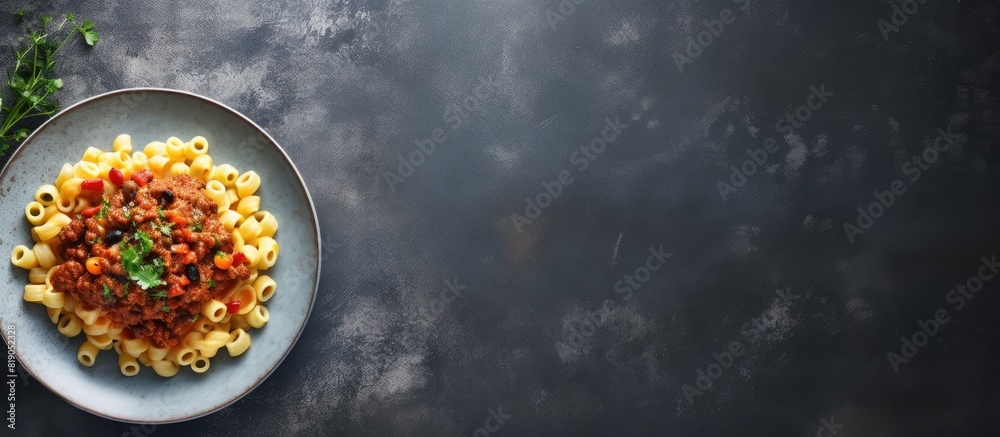 Poster stewed pasta with minced beef and vegetables macaroni in navy style on a plate grey concrete backgro