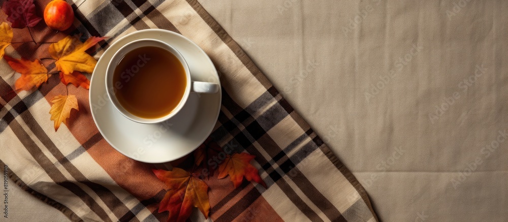 Poster Autumn composition Cup of coffeecup autumn leaves on on white checkered cloth Flat lay top view copy space