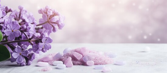 Concept of Spa cosmetic and cosmetic procedures Bath salt in effervescent tablets with lilac flowers on light concrete background The concept of a waste free lifestyle Space for text