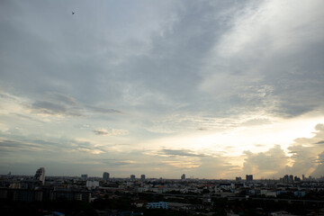 reflection light sun ray from beside white clouds in cloudy daytime with  dusk sunrise sunset twilight time sky with city high view 