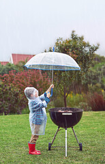 Outdoor, grill and rain in weather, umbrella and boy with waterproof for food, raincoat and winter....