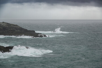 Rocky Shoreline Surrounding Vast Body of Water
