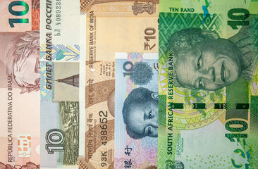 stacked banknotes of the brics countries 