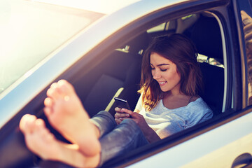 Woman, car and phone by window in summer for travel, freedom and vacation with parking outdoor....
