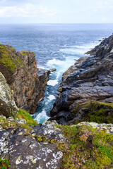 Water Flowing From Rocky Cliff
