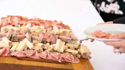 Salami and cheese plate, with space for your logo or text.