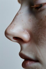 Close-up of a woman's face with freckles. Suitable for beauty and skincare concepts