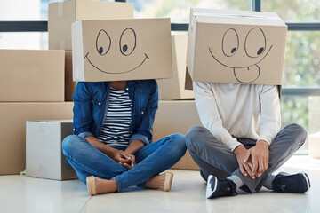 Couple, box and face emoji in new house for comedy, funny and happiness for dream home. Homeowner,...