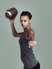 American, football player and portrait of woman in sport on studio background with fitness in game....