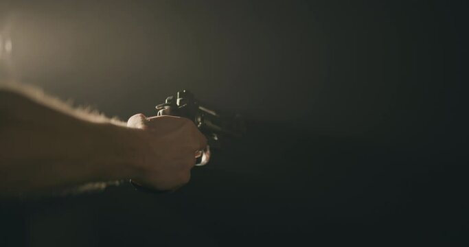 Man firing a revolver