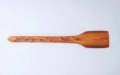 Wooden kitchen utensils stacked view, spoon and spatula