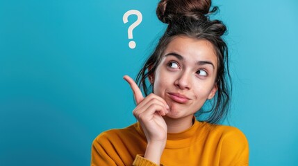 Obraz premium A young cute woman with questions sign above isolated on blue background, Question mark