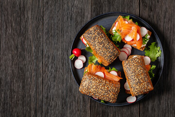 smoked salmon sandwiches on rye bread rolls