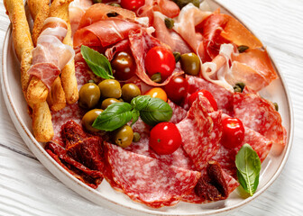 italian antipasto plate of cured meat and veggies