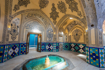 Interior view of the bathhouse of Sultan Amir Ahmed, with its ornate frescoes and tiles. Kashan,...