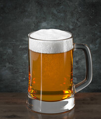 Mug with beer on wooden table against the wall in grunge style. Bar theme.  Dark environment. 3d rendering.