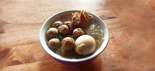 bakso. indonesian beef meatball served with noodle and boiled egg