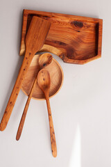 Wooden kitchen utensils stacked view, spoon and spatula