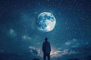 Man standing in the night sky and looking at the full moon