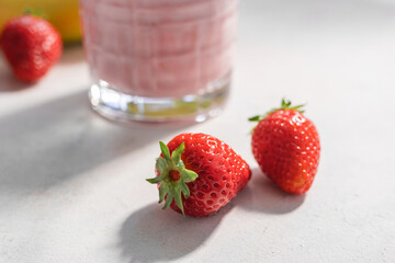 Strawberry smoothie drink, blended cocktail, milkshake in a glass
