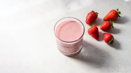 Strawberry smoothie drink, blended cocktail, milkshake in a glass