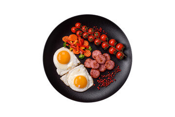 Delicious nutritious breakfast with fried eggs, sausage, steamed vegetables