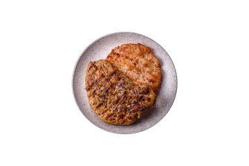 Delicious juicy pork steak with salt, spices and herbs