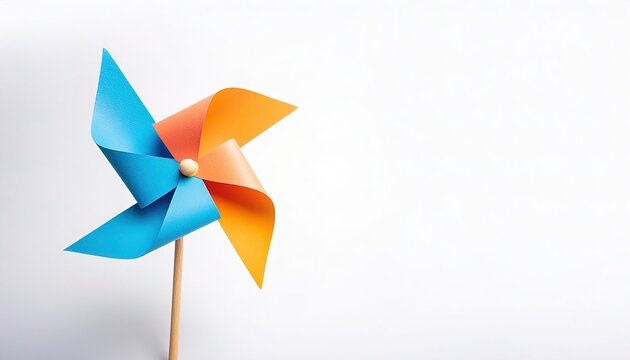 pinwheel or windmill paper origami isolated on white background simple starter craft for kids for weekend entertainment. ESG and Clean Energy Concept. Wind Turbine Paper into the Sky. Decrease Carbon
