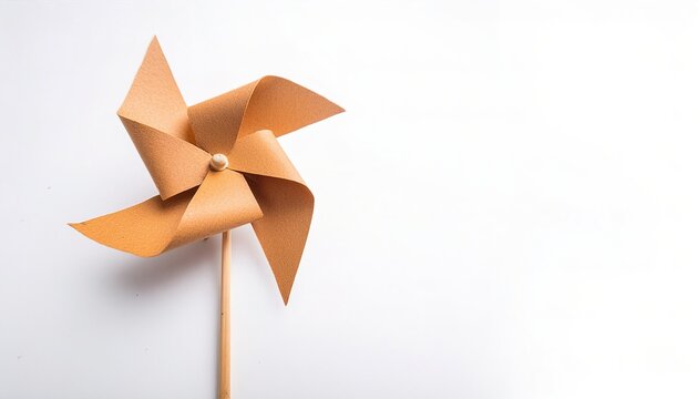 pinwheel or windmill paper origami isolated on white background simple starter craft for kids for weekend entertainment. ESG and Clean Energy Concept. Wind Turbine Paper into the Sky. Decrease Carbon