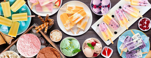 Cool summer food table scene. Group of refreshing ice cream, popsicle and frozen treats. Top view...