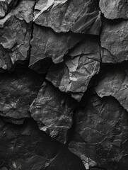Dark grey stone texture background. Natural pattern of black rock surface,pile of charcoal isolated on black background. top view,black crumpled paper background texture